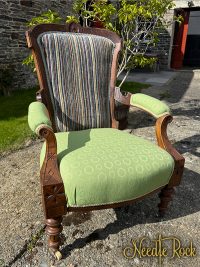 green and striped traditional armchair
