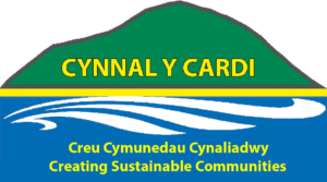 About Us: Cynnal y Cardi logo with the slogan 'Creating Sustainable Communities' in English and Welsh.