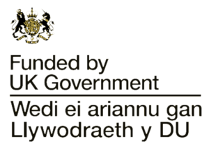 About Us: Funded by UK Government with bilingual text in English and Welsh, featuring the UK Government crest.