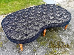 Giant deep-buttoned kidney-shaped footstool that used to be in Libertines, Aberystwyth.