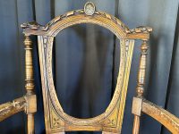 Detailed carvings on an antique French chair