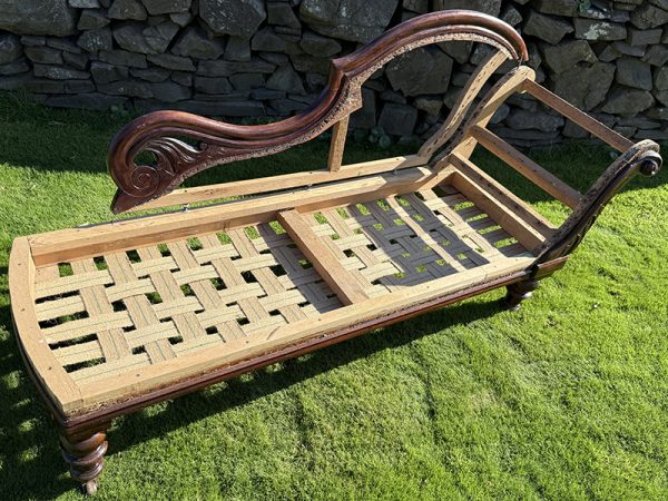 Antique chaise longue frame with decorative arm