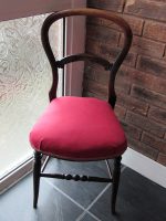 Delicate balloon-back chair. Decorative and delicate balloon-back chair with traditional upholstery.