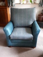 Favourite reupholstered armchair. Favourite armchair, reupholstered with new fibre back and new seat cushion, teal carcass, and complimentary stripy fabric.