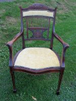 Pin-stuffed carver chair. Regency-style Carver chair with pin-stuffed upholstery.