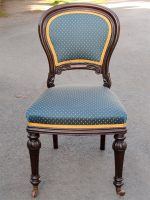 A mahogany traditionally upholstered balloon back dining chair with back pads, blue upholstery and gold braid.