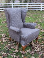 Grey Parker Knoll Masculine Parker Knoll covered in a light-reflective grey fabric.