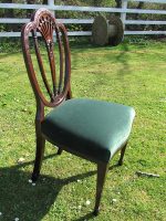 Victorian ornate shield-back chair. Victorian ornate shield-back chair with square-shaped front legs.