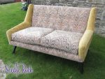 1970's original G-Plan sofa. 1970's chic original G-Plan sofa with sprung back, refurbished with retro pattern colour scheme, and contrasting buttons.