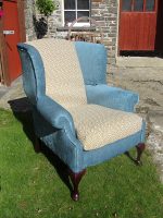 Parker Knoll wingback armchair Refurbished Parker Knoll wingback armchair, teal fabric with ochre geometric contrast.
