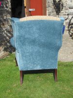 Parker Knoll wingback armchair, Refurbished Parker Knoll wingback armchair, teal fabric with ochre geometric contrast (back view).