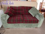 2-seater caravan sofa bed. 2-seater caravan sofa bed with deep red tartan and contrasting sage green carcass.