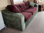 Static caravan upholstery 3 seater sofa in a static caravan - deep red tartan and contrasting pine green