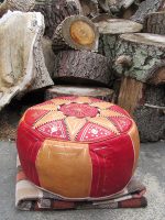 Leather pouffe. Leather pouffe filled with wood shavings from the workshop.