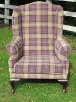 Parker Knoll Wingback armchair. Parker Knoll Wingback armchair covered in a purple/green tartan fabric.