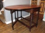 Refurbished full-size gate-leg table. Refurbished full-size gate-leg table with barley twist legs and central full-length drawer.