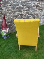 Fluted Bentwood armchair Fluted Bentwood armchair covered in a vibrant sunflower yellow with contrasting grey rope-braid (back view)