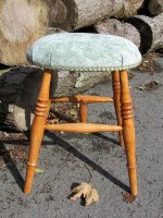 Upholstered modern stool. Modern wooden stool with a comfy upholstered seat.