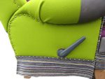 Kiwi-green close-up showing details. Close-up of side details on reclining Parker Knoll chair.