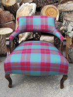 Ornate tartan tub chair Ornate tub chair with family tartan upholstery.