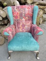 Reupholstered Parker Knoll Wingback armchair. Funky reupholstered Parker Knoll Wingback armchair, pewter-coloured woodwork and tear-drop facings. Unusual but striking!