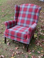 Parker Knoll Wingback Armchair. Parker Knoll Wingback Armchair covered in cherry/green tartan fabric (front view).
