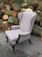 Parker Knoll Wingback Armchair. Parker Knoll Wingback Armchair covered in a grey wool fabric with a vibrant red stripe.