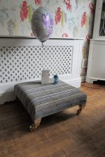 Wedding gift footstool for Ed & Zo in the big house! Wedding gift footstool with square-castor brass legs.