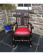 A beautiful carved wooden chair with traditional upholstery and springs. A beautiful carved wooden chair with traditional upholstery and springs.