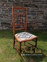 Dainty pin-stuffed chair with bold tiger stripe fabric. Tiger stripe pin-stuffed chair