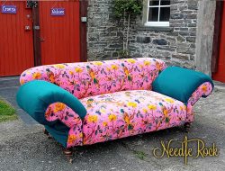 A double drop-arm sofa, traditionally reupholstered, and given a fabulous bold, beautiful and unrestrained transformation.