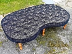 Giant deep-buttoned kidney-shaped footstool that used to be in Libertines, Aberystwyth.